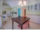 Inviting dining area with a view to the kitchen and adjoining rooms at 2340 Rolling Acres Sw Dr, Conyers, GA 30094