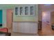 Charming dining area with white cabinets and a glimpse into the adjoining rooms at 2340 Rolling Acres Sw Dr, Conyers, GA 30094