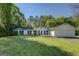 Charming single-story home featuring a manicured lawn and attached two-car garage, perfect for suburban living at 2340 Rolling Acres Sw Dr, Conyers, GA 30094