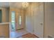 Bright foyer featuring a decorative front door with tile flooring transitioning to hardwood at 2340 Rolling Acres Sw Dr, Conyers, GA 30094
