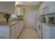 Bright kitchen featuring ample counter space, cabinetry, and modern appliances at 2340 Rolling Acres Sw Dr, Conyers, GA 30094