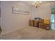 Additional living area with neutral carpet could be flex space or formal dining area at 2340 Rolling Acres Sw Dr, Conyers, GA 30094