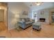 Inviting living room with a vaulted ceiling, wood-look flooring, and cozy seating arrangement at 2340 Rolling Acres Sw Dr, Conyers, GA 30094