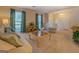 Cozy living room with plush carpeting, natural light, and comfortable seating area at 2340 Rolling Acres Sw Dr, Conyers, GA 30094