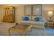 Elegant living room featuring a comfortable sofa, decorative pillows, and tasteful furnishings at 2340 Rolling Acres Sw Dr, Conyers, GA 30094