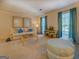 Relaxing living room featuring comfortable furniture, soft lighting, and large windows at 2340 Rolling Acres Sw Dr, Conyers, GA 30094
