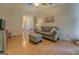 Inviting living room with a vaulted ceiling, wood-look flooring, and cozy seating arrangement at 2340 Rolling Acres Sw Dr, Conyers, GA 30094