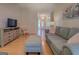 Comfortable living room with a plush gray sofa, stylish decor, and natural light at 2340 Rolling Acres Sw Dr, Conyers, GA 30094