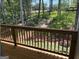 Wood railing on deck with views of backyard and mature trees at 3383 Milan Ct # 4 Plapprox Sqft 1, Douglasville, GA 30135