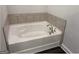 A bright and clean bathtub with tile backsplash at 3383 Milan Ct # 4 Plapprox Sqft 1, Douglasville, GA 30135