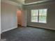 Bright bedroom with large window and an attached closet at 3383 Milan Ct # 4 Plapprox Sqft 1, Douglasville, GA 30135