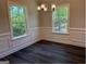 Spacious dining room with decorative molding, hardwood flooring, and natural lighting at 3383 Milan Ct # 4 Plapprox Sqft 1, Douglasville, GA 30135