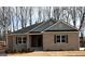 Charming, new construction, one-story home featuring a brick facade and a classic gabled roofline with gray accents at 3383 Milan Ct # 4 Plapprox Sqft 1, Douglasville, GA 30135