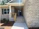 Inviting brick home featuring a covered front porch and steps leading to the front door at 3383 Milan Ct # 4 Plapprox Sqft 1, Douglasville, GA 30135