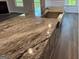 Kitchen island features a granite countertop and stainless steel sink at 3383 Milan Ct # 4 Plapprox Sqft 1, Douglasville, GA 30135