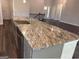 Kitchen island boasts granite countertops and stainless steel appliances at 3383 Milan Ct # 4 Plapprox Sqft 1, Douglasville, GA 30135