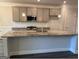 Features include stainless steel appliances, a large island and light colored cabinetry at 3383 Milan Ct # 4 Plapprox Sqft 1, Douglasville, GA 30135