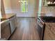 The kitchen showcases granite countertops, stainless steel appliances, and a farmhouse sink at 3383 Milan Ct # 4 Plapprox Sqft 1, Douglasville, GA 30135