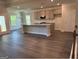 Open floor plan features the kitchen and living room with hardwood flooring at 3383 Milan Ct # 4 Plapprox Sqft 1, Douglasville, GA 30135
