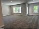 Open living space with carpet floors, multiple windows, and an abundance of natural light at 3383 Milan Ct # 4 Plapprox Sqft 1, Douglasville, GA 30135