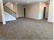 Expansive living space featuring a staircase, neutral carpeting, and abundant natural light at 3383 Milan Ct # 4 Plapprox Sqft 1, Douglasville, GA 30135