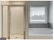 Modern bathroom showcasing a shower and separate tub, complete with a window for natural light at 300 San Anselmo St, Locust Grove, GA 30248
