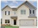 Charming two-story home with a brick facade and a two-car garage at 300 San Anselmo St, Locust Grove, GA 30248