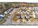 Aerial view of a quiet neighborhood showcasing multiple homes, streets, and lush greenery at 103 Watercress Ct, Stockbridge, GA 30281