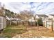 Backyard featuring a wooden deck, fenced yard, and mature trees, perfect for outdoor enjoyment at 103 Watercress Ct, Stockbridge, GA 30281