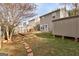 Backyard with wooden deck, storage shed, fenced yard, and mature trees creating privacy at 103 Watercress Ct, Stockbridge, GA 30281