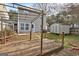 Inviting backyard featuring a wooden deck, storage shed, and complemented by a well-maintained fenced yard at 103 Watercress Ct, Stockbridge, GA 30281