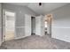 Spacious bedroom with closet, ceiling fan, neutral walls and carpets with bath access at 103 Watercress Ct, Stockbridge, GA 30281
