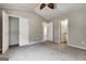 Spacious bedroom with closet, ceiling fan, neutral walls and carpets with bath access at 103 Watercress Ct, Stockbridge, GA 30281