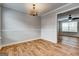 Dining room with hardwood floors and passage to living room at 103 Watercress Ct, Stockbridge, GA 30281