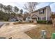 Exterior view of the home showing the side yard, manicured landscaping, and surrounding neighborhood at 103 Watercress Ct, Stockbridge, GA 30281