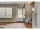 Foyer with hardwood floors, window with blinds, and a staircase leading to the upper level at 103 Watercress Ct, Stockbridge, GA 30281