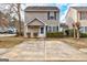 Charming two-story home featuring neutral siding, black shutters, manicured landscaping, and a concrete driveway at 103 Watercress Ct, Stockbridge, GA 30281