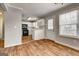 Well-lit kitchen offering white cabinets, black appliances, and tile floors at 103 Watercress Ct, Stockbridge, GA 30281
