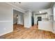 Well-lit kitchen offering white cabinets, black appliances, and tile floors at 103 Watercress Ct, Stockbridge, GA 30281