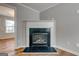Living room featuring hardwood floors and a fireplace with a decorative mantel at 103 Watercress Ct, Stockbridge, GA 30281