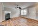Bright living room with modern fireplace and attractive wood grain flooring at 103 Watercress Ct, Stockbridge, GA 30281