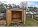 A spacious storage shed with an open door and ready for all your storage needs in a fenced yard at 103 Watercress Ct, Stockbridge, GA 30281
