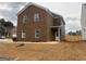 Two-story home showcasing brick and gray siding, plus a manicured lawn at 5301 Tolar Rd # 95, South Fulton, GA 30213