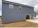 Home featuring gray siding and an attached garage, all on a spacious lot at 5301 Tolar Rd # 95, South Fulton, GA 30213
