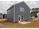 Home showcasing gray siding, bright windows, and a neatly arranged backyard at 5301 Tolar Rd # 95, South Fulton, GA 30213