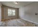 Bedroom with a large window overlooking the front yard, ready for renovation and personalization at 131 Turning Pt, Stockbridge, GA 30281