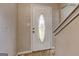 Front door featuring an oval window with design elements and side knob at 131 Turning Pt, Stockbridge, GA 30281