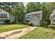 Home with a green lawn, mature trees, a private driveway, and a well maintained exterior at 131 Turning Pt, Stockbridge, GA 30281