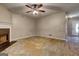 The living room features a ceiling fan and is ready for renovation and personalization to make it your own at 131 Turning Pt, Stockbridge, GA 30281