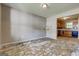 Living room with animal decals on the wall, open to kitchen. The space awaits transformation at 131 Turning Pt, Stockbridge, GA 30281